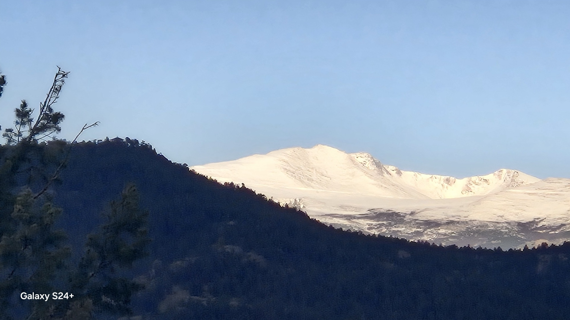 Snowcapped Front Range peak above the foothills