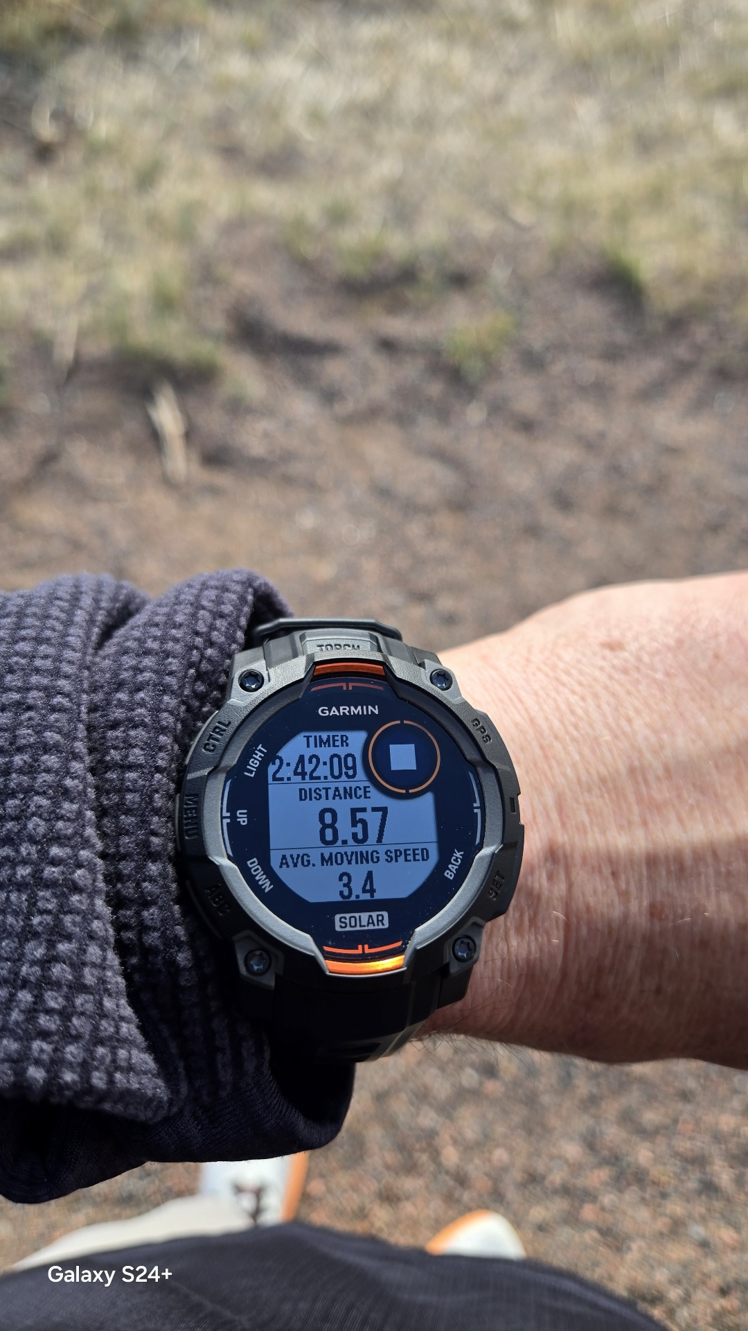 Garmin watch showing 2:42:09 and 8.57 miles